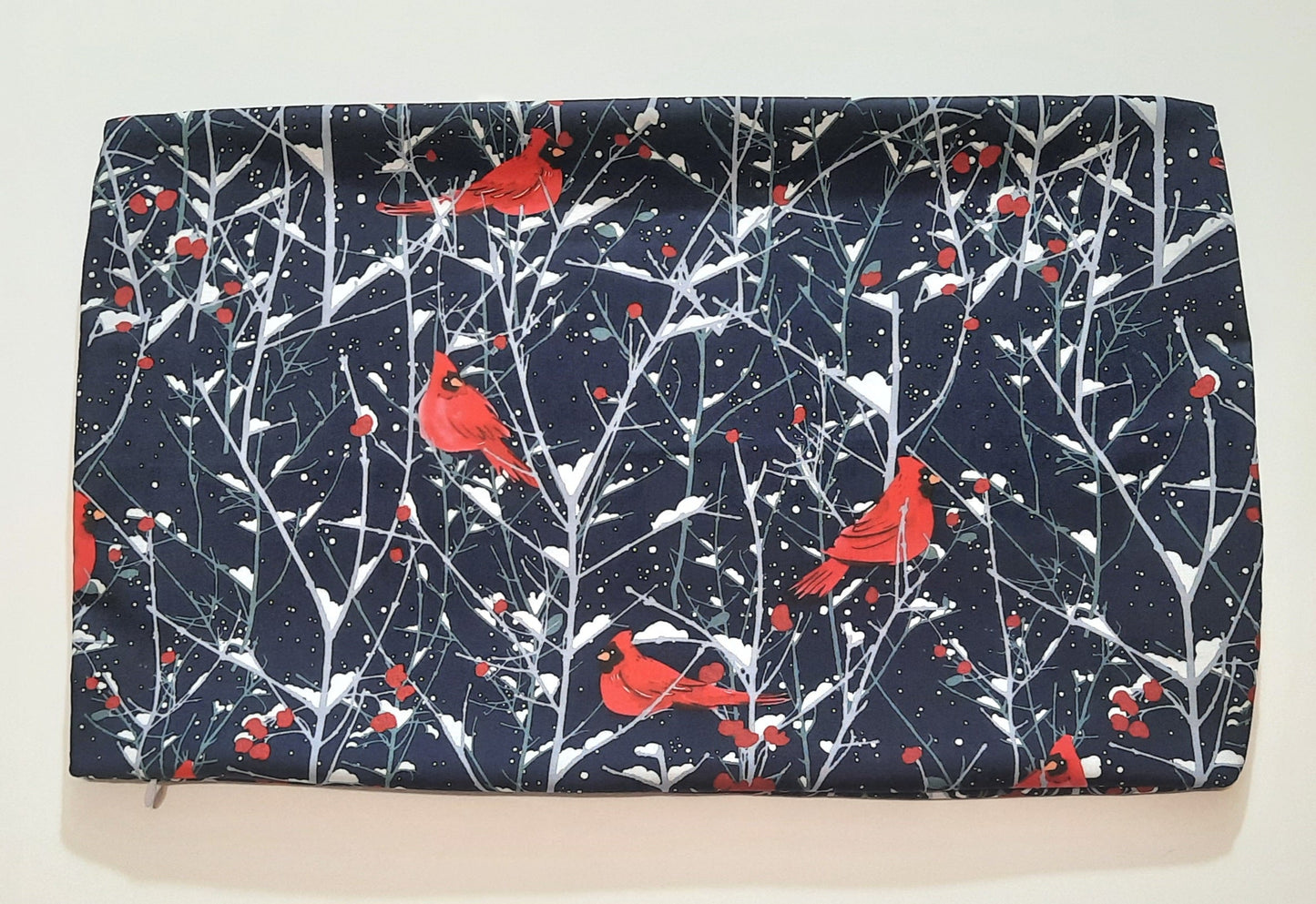 12"x18" Travel Pillow Cover. Dark blue with cardinals.