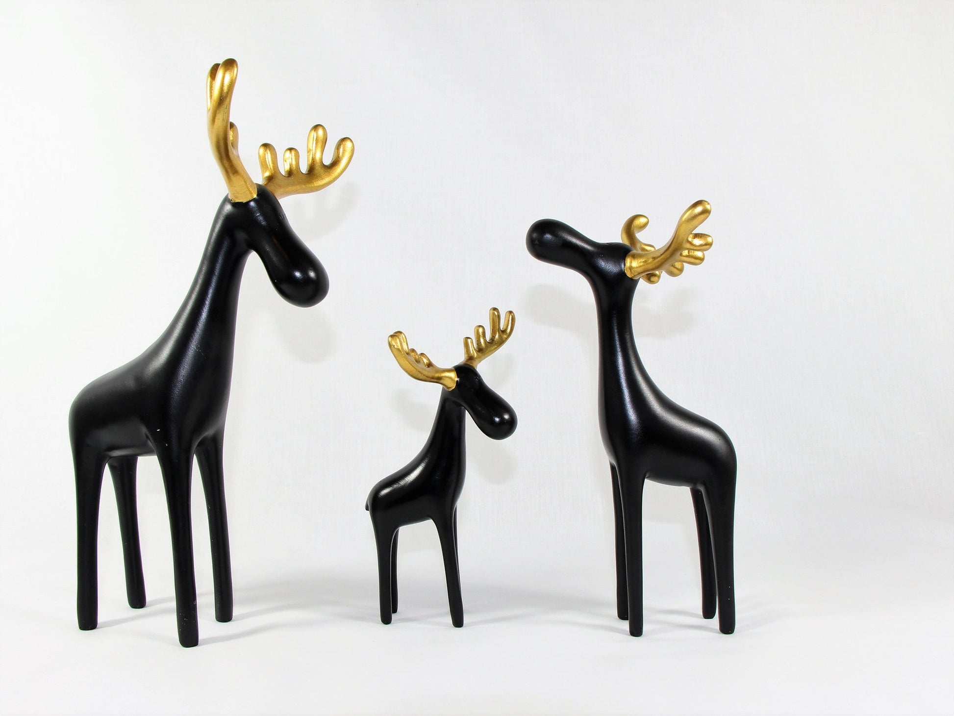 Family of Three Black Reindeer Sculptures with Golden Antlers - Samiksha's - Little Red General Store